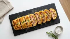 Slaný závin z listového těsta se šunkou a sýrem: rychlá večeře za 30 minut